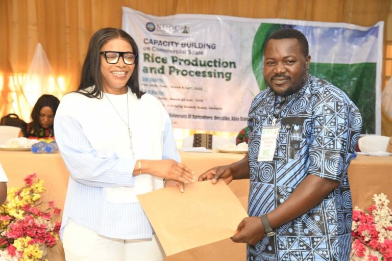 NDDC boosts rice production with N60m support for farmers NDDC with a beneficiary rice farmer